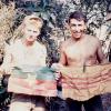Bobby Rowe (left) and Fred Perez (right) with captured enemy flags.