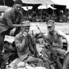 Lcpl. David P. Smeltser (deceased 8/7/07) sitting on the left. The Marine standing is Lcpl. Jose Pacheco (KIA 13 April 1966) on our last patrol across the river south west from Hill 55. Marine on right is PFC Gil Nickerson (KIA 8/18/65).